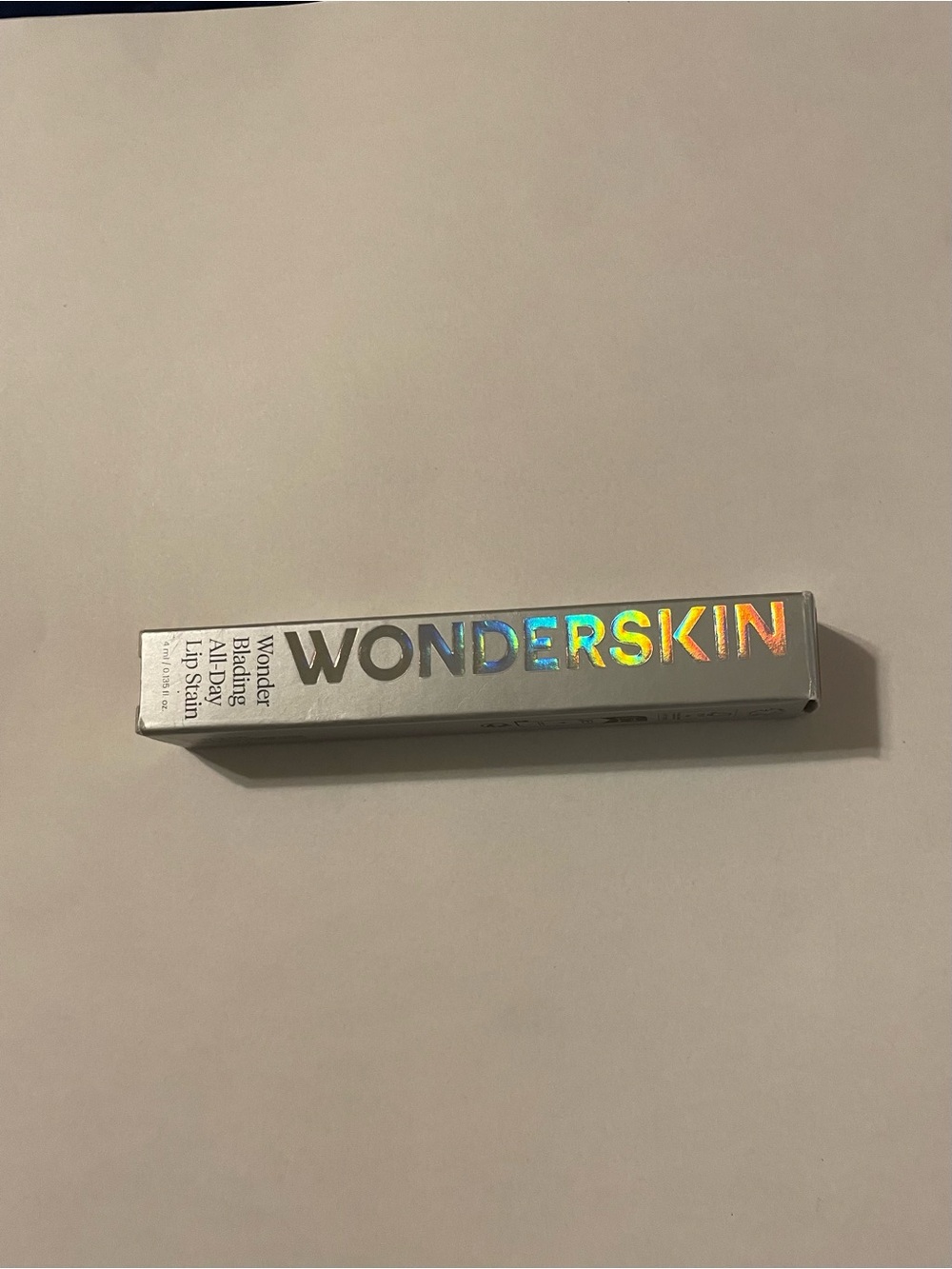 WONDERSKIN Wonder Blading Lip Stain Playful is a burnt berry